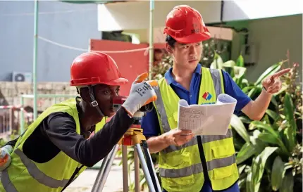  ?? ?? A Chinese engineer and a Senegalese employee work on the project site in Dakar, Senegal, on 1 November 2023