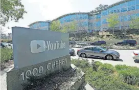  ?? [JEFF CHIU/THE ASSOCIATED PRESS] ?? A YouTube sign is shown across the street from the company’s offices Tuesday in San Bruno, Calif. A woman opened fire at YouTube headquarte­rs Tuesday, setting off a panic among employees and wounding several people before fatally shooting herself,...