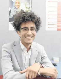  ?? PHOTO: LINDA ROBERTSON ?? Rewarding work . . . Red Cross Otago youth coordinato­r Sakhr Munassar sits at his workplace.