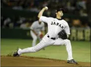  ?? TORU TAKAHASHI — THE ASSOCIATED PRESS FILE ?? In this Nov. 19, 2015 photo, Japan’s Shohei Otani pitches against South Korea during the Premier12 world baseball tournament at Tokyo Dome in Tokyo. Shohei Otani is likely to leave Japan and sign with a Major League Baseball team after this season.