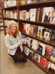  ?? ?? Heather Stover, author of her hopeful memoir, The Change in Us, poses next to her book in the Ontario Barnes & Noble store
Photo Courtesy of Heather Stover