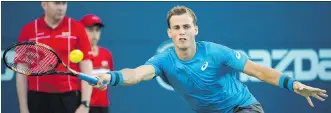  ?? NATHAN DENETTE/THE CANADIAN PRESS ?? Vasek Pospisil of Vancouver returns the ball against Jeremy Chardy of France during the first round at the Rogers Cup in Toronto on Tuesday. Pospisil won the match.
