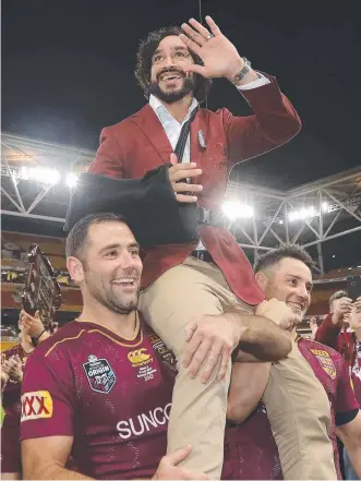  ?? FITTING SEND- OFF: Retiring Maroons legend Johnathan Thurston is chaired off by Cameron Smith and Cooper Cronk after their State of Origin series win on Wednesday night. ??