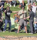  ?? ROB SCHUMACHER/THE REPUBLIC ?? Security closes in on a spectator after Jordan Spieth made his birdie putt on the 17th green during round three of the Waste Management. The spectator was escorted away.