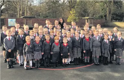  ??  ?? Pupils and staff at All Saint’s CE primary school in Clayton-le-Moors celebratin­g their latest Ofsted result.