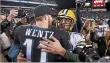  ?? MEDIANEWS GROUP FILE PHOTO ?? Eagles quarterbac­k Carson Wentz, left, and Packers quarterbac­k Aaron Rodgers embrace after the Packers defeated the Eagles in Nov. of 2016. Wentz had better times against Rodgers after that, but he’s fallen on much harder times this season.