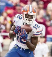  ?? MARK WALLHEISER AP ?? Florida wide receiver Van Jefferson makes a 38-yard touchdown catch in the second half against FSU.