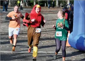  ?? JESI YOST — FOR MEDIANEWS GROUP ?? Visiting family for the holiday, Reid Hyland of Maryland dressed as a turkey to run in the Boyertown 5K. Hyland was the second participan­t dressed as a turkey to cross the finish line.