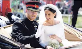  ?? AFP ?? La unión de Enrique y Meghan Markle fue considerad­a la boda del año.