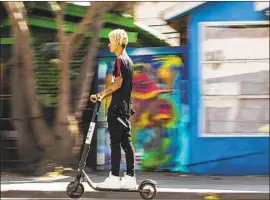  ?? Maria Alejandra Cardona Los Angeles Times ?? WHILE some sites are off-limits to Bird scooters at property owners’ request, workers and owners at others were surprised to learn they were in a red zone.