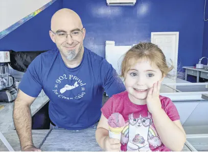  ?? CHELSEY GOULD • TRURO NEWS ?? Sean Macdonald and his “boss” — youngest daughter, three-year-old Sylvia. The ice cream shop owner has moved the business out of his home, but the family continues to be actively involved.