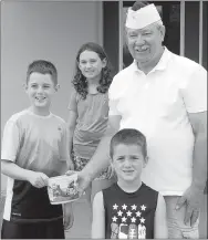  ?? Photo Submitted ?? A.J., Kenlee and Barrett Moore presented the money they raised to VFW Quartermas­ter Frank Lee.