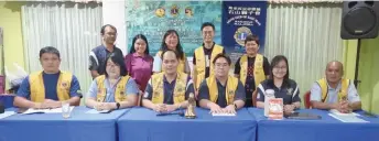  ?? ?? Jong (seated, third left) and committee members pose for a photo-call after the AGM.