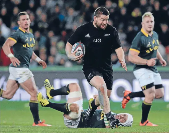  ?? Photo: GETTY IMAGES ?? Dane Coles bursts through the South African defence on his way to a brilliant try in Johannesbu­rg earlier this year.