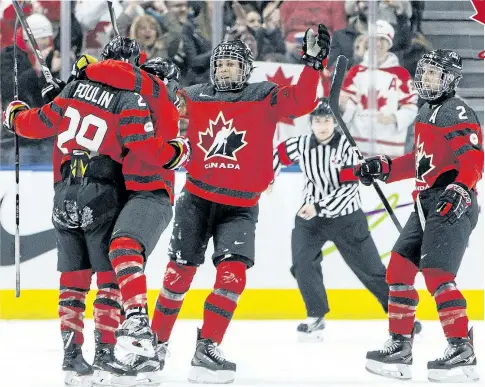  ?? JASON FRANSON/THE CANADIAN PRESS ?? Team Canada celebrates a goal against Team USA during National Women’s Team series hockey yesterday in Edmonton,