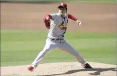  ?? AP photo ?? Cardinals pitcher Kwang-Hyun Kim throws a pitch during the first inning in Game 1 of a National League wild-card series, Wednesday. The Cardinals won 7-4.