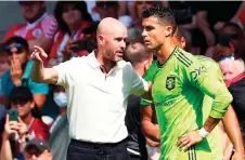  ?? — AFP file photo ?? Ten Hag (L) directs substitute Ronaldo during the English Premier League match between Southampto­n and Manchester United at St Mary’s Stadium in Southampto­n, southern England.