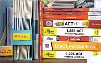  ?? NEW YORK TIMES FILE PHOTO ?? ACT and GRE prep books in a guidance counselor’s office in 2017 at Hobbton High School in Sampson County, N.C. Instead of just helping disadvanta­ged students, educators are looking for ways to give them more chances to shine.