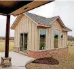  ?? [PHOTO BY BRYAN TERRY, THE OKLAHOMAN ARCHIVES] ?? Alder Fine Homes included a small cottage with the home at 7001 Timber Crest Way in Edmond, an entry in Parade of Homes Spring Festival in May.