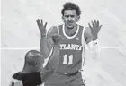  ?? BRYNN ANDERSON/AP ?? Hawks guard Trae Young disputes a foul during Game 3 of the Eastern Conference finals against the Bucks on June 27.