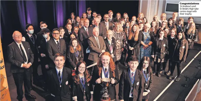  ?? ?? Congratula­tions
St Andrew’s and St Bride’s High take centre stage with their trophy