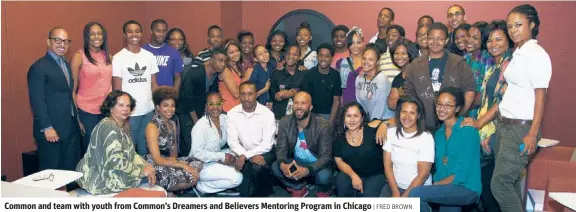  ??  ?? Common and team with youth from Common’s Dreamers and Believers Mentoring Program in Chicago | FRED BROWN