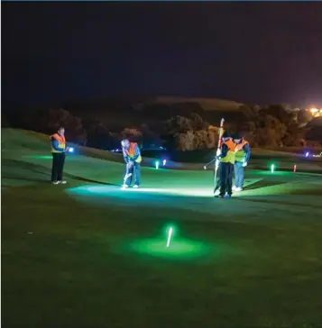  ??  ?? Night golf competitor­s on the 18th green at Wicklow Golf Club last week.