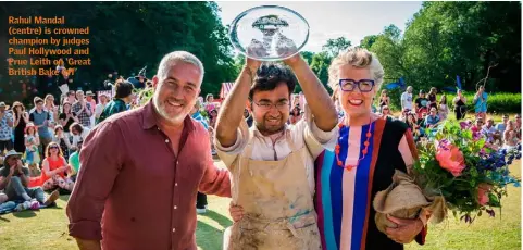  ??  ?? Rahul Mandal (centre) is crowned champion by judges Paul Hollywood and Prue Leith on ‘Great British Bake Off’