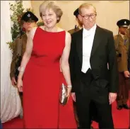  ??  ?? Philip and Theresa May, in an Amanda Wakeley “clean glam” evening dress.
