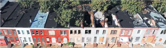  ?? JERRY JACKSON/BALTIMORE SUN ?? The vacant row homes in the 1800 block of N. Chester St. are slated for eventual demolition. Some money set aside for demolition­s is being used for other projects.