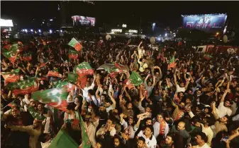  ?? K.M. Chaudry / Associated Press ?? Supporters of ousted Pakistani Prime Minister Imran Khan rally in Lahore to denounce his removal from office. Khan’s successor is to be elected and sworn in by Parliament on Monday.
