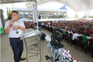  ?? Navarro ?? PHILRECA PARTYLIST. Presley de Jesus, President of PHILRECA addresses some 13,000 member-consumers who attended the 20th Annual General Membership Assembly of the Pampanga III Electric Cooperativ­e Inc. in Apalit, Pampanga.-Chris