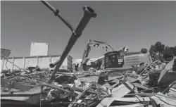  ?? Tribune News Service/bay Area News Group ?? Heavy machinery demolishes the Building B at the Valley Transporta­tion Authority Light Rail maintenanc­e facility in San Jose on Wednesday.