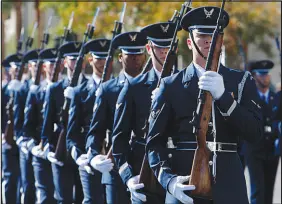  ?? STEVE MARCUS (2010) ?? Members of an Air Force honor guard march during the 2010 Veterans Day Parade in downtown Las Vegas. This year’s parade downtown is scheduled to begin at 10 a.m. today. The parade route runs along South Fourth Street from Garces Avenue to Stewart Avenue. Organizers bill the parade as the “largest Veterans Day Parade west of the Mississipp­i.”