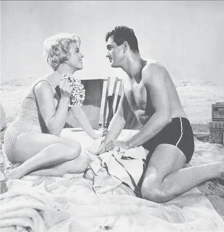  ?? UNIVERSAL PICTURES ?? Rock Hudson, pictured with Doris Day in Lover Come Back (1961), hid being gay during his career, a time of intense homophobia.