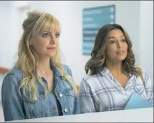  ??  ?? In “Overboard,” the conniving pulled off by Anna Faris, left, and Eva Longoria produces an unexpected outcome.