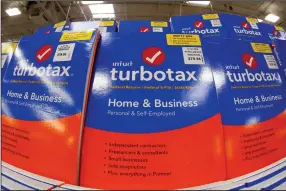  ?? (AP) ?? TurboTax software is displayed in a Sam’s Club in Pittsburgh. Under the terms of a settlement signed by the attorneys general of all 50 states, Mountain View, Calif.-based Intuit Inc. will suspend TurboTax’s “free, free, free” ad campaign and pay restitutio­n to nearly 4.4 million taxpayers.