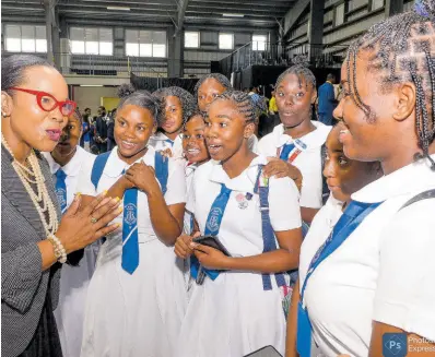  ?? ?? Permanent Secretary in the Ministry of Education and Youth Dr Kasan Troupe, engages in conversati­on with students from the Mount Alveria High School in Montego Bay, St James, at the ‘Rapping with the Minister’ forum at Jamaica College, St Andrew, on Tuesday.