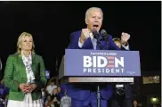  ?? MARCIO JOSE SANCHEZ / AP ?? Democratic presidenti­al candidate former Vice President Joe Biden speaks next to his wife Jill during a primary election rally Tuesday in Los Angeles.