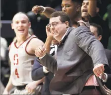  ?? JEFF CHIU — THE ASSOCIATED PRESS ?? Stanford head coach Jerod Haase, right, and players react during the Cardinal’s 77-73 win at Cal. Stanford moved into a tie for fifth place.