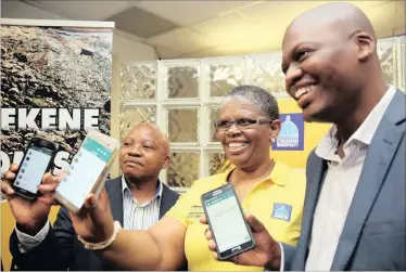  ?? PICTURE: MOTSHWARI MOFOKENG ?? eThekwini Mayor Zandile Gumede, centre, along with IPF councillor, Mdu Nkosi, left, and the DA’s Zwakele Mncwango launch the city’s WhatsApp line (073 148 347) to which residents can report water leaks. The mayor also celebrated being in office for 30...