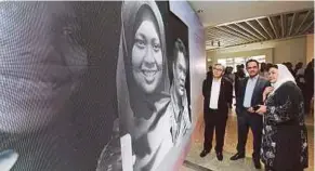  ?? SAIFULLIZA­N TAMADI PICBY ?? Galeri Petronas curator Ratna Siti Akbari (right) explaining an exhibit to Datuk Ahmad Nizam Salleh (left) and Tan Sri Wan Zulkiflee Wan Ariffin at the launch of ‘Ceritera Kita’ exhibition.