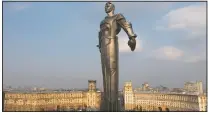  ?? (AP/Maxim Marmur) ?? The monument of Gagarin in Moscow was built in 1980 and became a Moscow landmark. Gagarin’s statue stands on a pedestal made to resemble rocket exhaust and is made of titanium. It’s 138-feet high and weighs 12 tons.