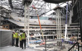  ?? Photos by Carlos Avila Gonzalez / The Chronicle ?? Constructi­on continues on the new arena for the National Basketball Associatio­n champion Warriors. The Chase Center arena is scheduled for a September 2019 opening.