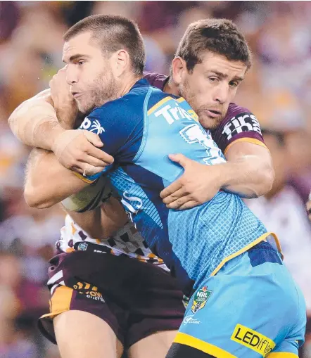  ?? Picture: GETTY IMAGES ?? Titans back-rower Ryan Simpkins (front) wants to remain at the club in 2018.