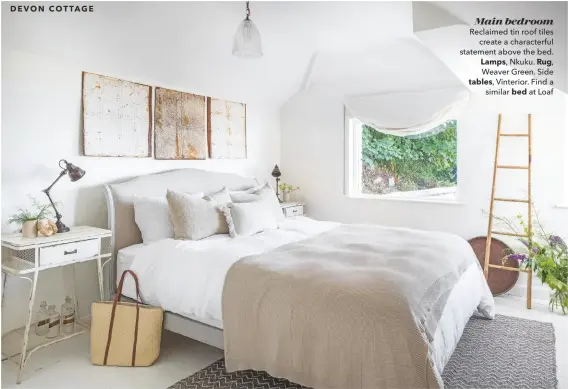  ??  ?? Main bedroom
Reclaimed tin roof tiles create a characterf­ul statement above the bed. Lamps, Nkuku. Rug, Weaver Green. Side tables, Vinterior. Find a similar bed at Loaf