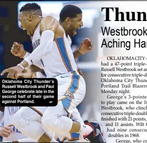  ??  ?? Oklahoma City Thunder’s Russell Westbrook and Paul George celebrate late in the second half of their game against Portland.