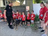  ?? ?? Vermilion’s K9 officer and its handler visit with children at Safety Town.