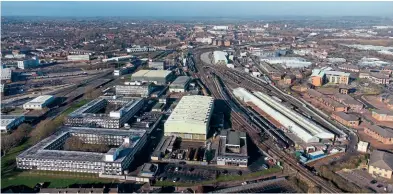  ?? Steve Donald ?? The East Midlands city of Derby has had long and illustriou­s links with the railways, and it has been chosen as the home of Great British Railways’ new headquarte­rs. This drone view shows the scale of the railway in the city, with the Railway Technical Centre in the foreground, Alstom’s Litchurch Lane train building factory partially visible on the left, and the Etches Park depot prominent on the right. Derby station can be seen in the distance.