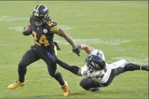  ?? AP photo ?? Steelers running back Benny Snell runs away from
Ravens outside linebacker L.J. Fort during the first half Wednesday.